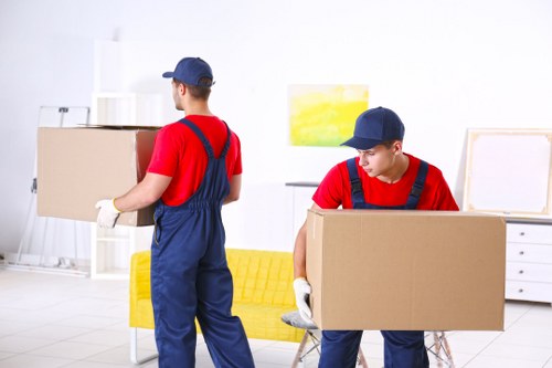 Moving boxes and furniture prepared for a Luton home removal