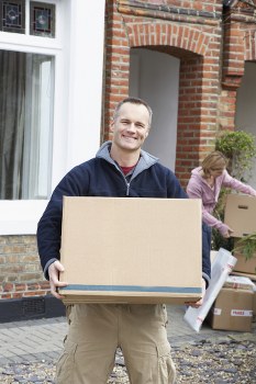 Moving team loading furniture from a local property
