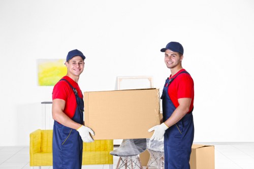 Removal team sorting recyclable moving materials in Luton
