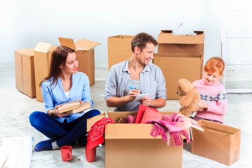 Moving van and packed boxes for a home move in Luton