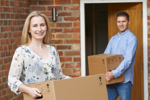 Professional movers handling household items in Luton