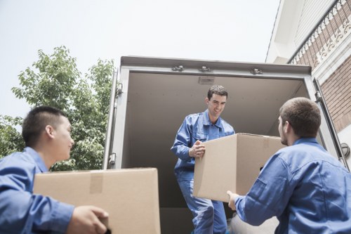 Careful packing of household items by a local moving team in Luton