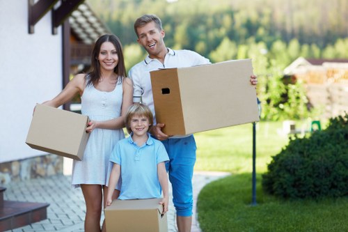 Removal helper carrying furniture for a local move in Luton