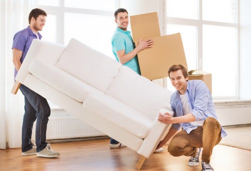 Local movers loading furniture for a house move in Luton