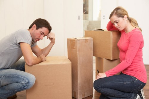 Van removal team transporting furniture through a Luton street