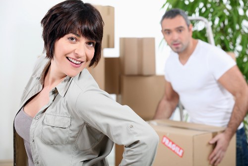 Local moving van loading household furniture in Luton