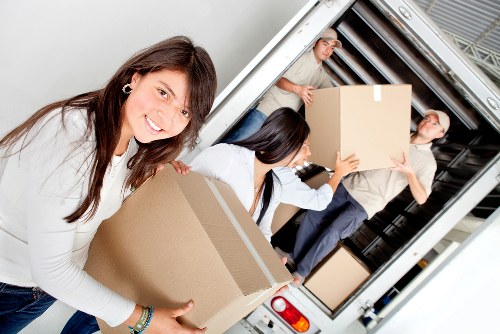 Furniture pick-up van loaded with mixed items for removal in Luton