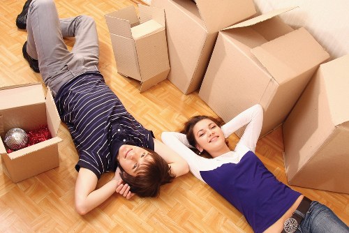 Local team handling furniture removal in a residential Luton street