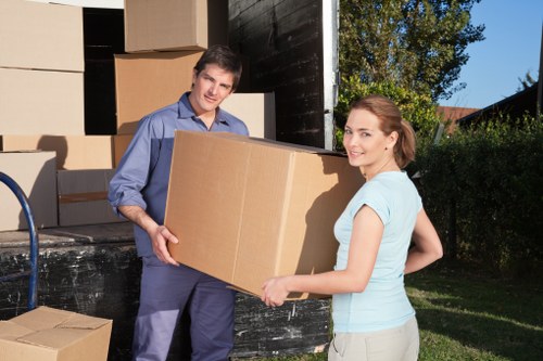 Local house movers unloading items at a new home